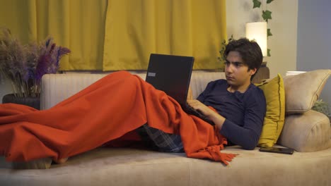 Man-using-laptop-while-lying-down.